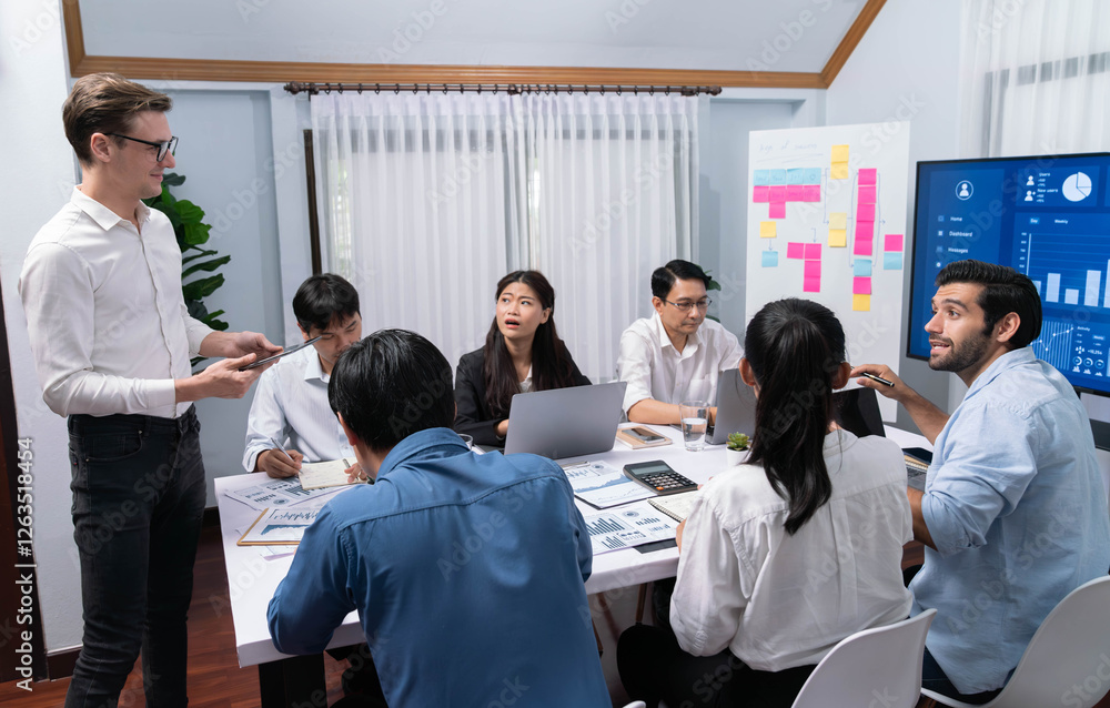 Leinwandbilder Analyst team utilizing BI Fintech to analyze financial data at table in meeting room. Businesspeople analyzing BI dashboard power for business insight and strategic marketing planning. Prudent