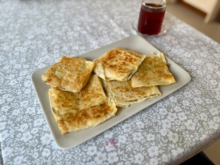 Traditional Turkish food, Turkish pancake gozleme with cheese and herb.