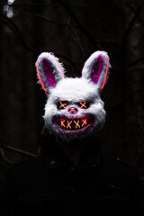 Creepy LED Bunny Mask in Dark Forest - Spooky Halloween Horror Concept