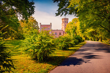 Sunny  morning view of Vecauces castle with empty tourist walkway, Latvia, Europe. Amazing summer...