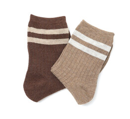 Pairs of folded soft socks isolated on white, top view
