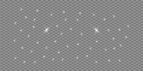 The dust sparks and golden stars shine with special light. Vector sparkles on a transparent background