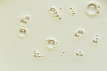 Close-up macro milk texture,Foam of milkshake, cocktail with bubbles as texture or background, top view