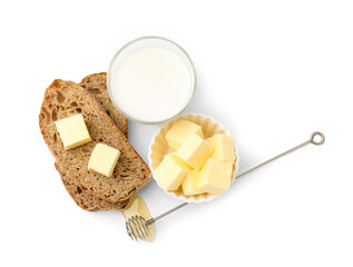 Slices of bread with butter, milk and honey isolated on white, top view