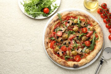 Tasty pizza with mushrooms, olives, tomatoes and arugula served on white textured table, flat lay. Space for text