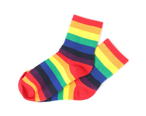 Pair of socks in LGBT colors on white background, top view