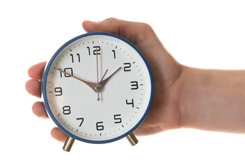 Man with alarm clock on white background, closeup