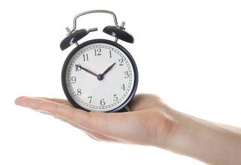 Man with black alarm clock on white background, closeup