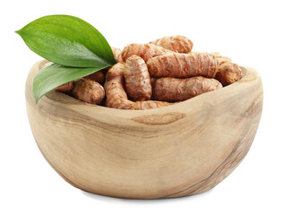 Raw turmeric roots and green leaves in bowl isolated on white