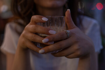woman holding a cup of coffee enjoy close-up.