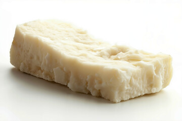 A piece of cheese on a white surface