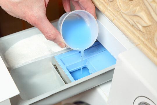 adding fabric softener to washing machine drawer
