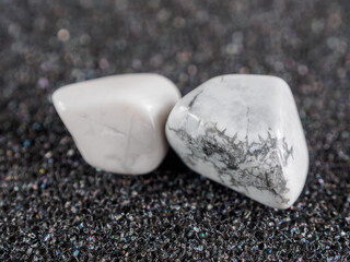 Howlite is a snow-white mineral with gray veins, symbolizing calmness and tranquility.