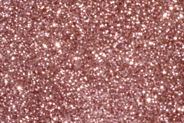 Sparkling rose gold glitter pattern with shimmering and dazzling light effects