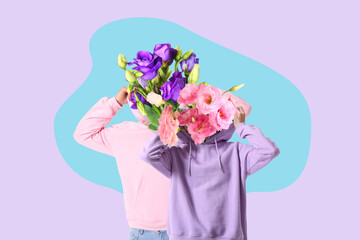 Cool young couple in hoodies on white background