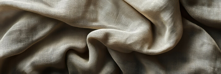 Draped fabric creating soft shadows and flowing folds in neutral tones