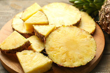 Slices of fresh ripe pineapple on table, closeup