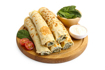 Tasty rolled crepes with cottage cheese, spinach and tomato isolated on white
