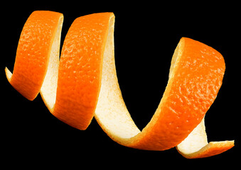 Orange skin in spiral form on a black background. Citrus zest of fresh orange fruit.