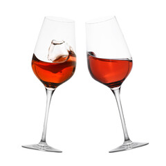 Glasses of splashing red wine isolated on white