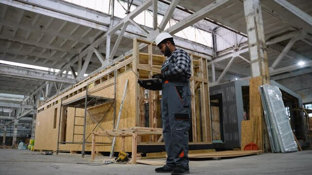 Indian engineer inspecting SIP panel house manufacturing