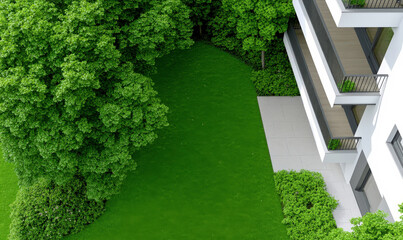 Lush Green Lawn and Trees Beside Modern Building with Outdoor Patio and Balconies in a Tranquil Residential Setting