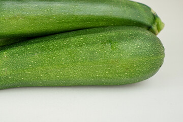 Fresh green zucchini isolated on white background
