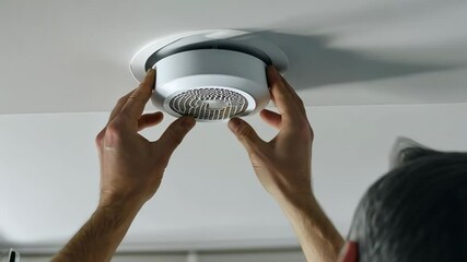 Installing a smoke detector for enhanced home safety and protection