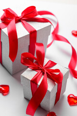 Gift boxes for Valentine's Day celebration on white background, closeup