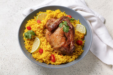 Bowl of traditional chicken biryani on white table