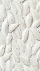 White feathers neatly arranged on a soft surface create an elegant and tranquil aesthetic for home decor or crafts