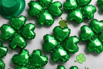 Balloons in shape of clover on grey background. St. Patrick's Day celebration