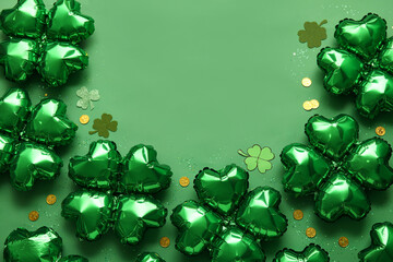 Balloons in shape of clover and coins on green background. St. Patrick's Day celebration