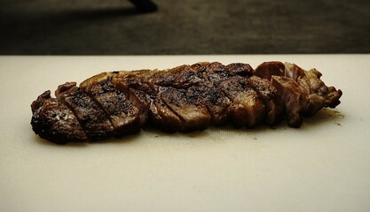 Freshly cooked steak, sliced into juicy pieces with a perfect sear. Tender, flavorful, and mouthwatering—ideal for culinary and food projects!