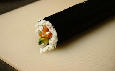 Sushi ingredients and preparation: fresh fish, rice, seaweed, and precise rolling techniques. Perfect for culinary and food-related projects!