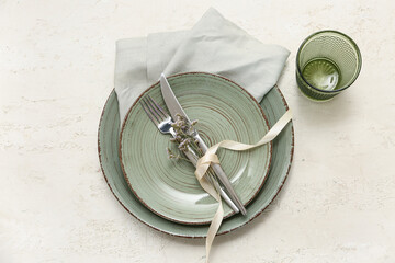 Beautiful table setting with gypsophila flowers on white background