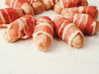 Pigs in blanket on a white color background. Simple pork meat food for a party or starter.