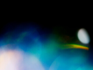 Blue color light leaks on dark background for design and special effects.