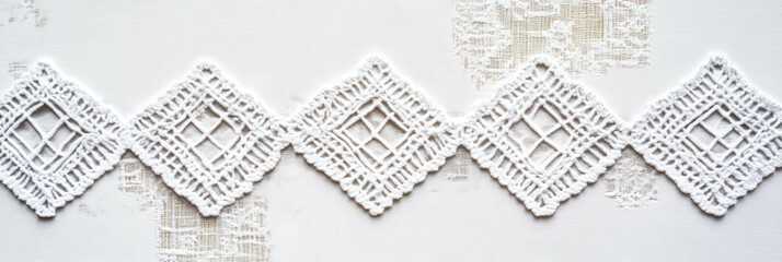 Obraz premium Elegant white embroidered tablecloth showcasing intricate geometric designs and delicate textures