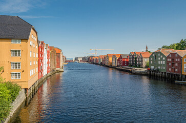 Wooden storehouses on the river banks in the old town of Trondheim, Norway