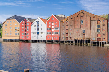 Wooden storehouses on the river banks in the old town of Trondheim, Norway
