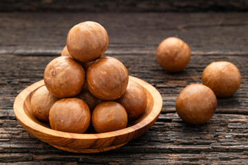 Organic macadamia nuts in bowl - Macadamia integrifolia