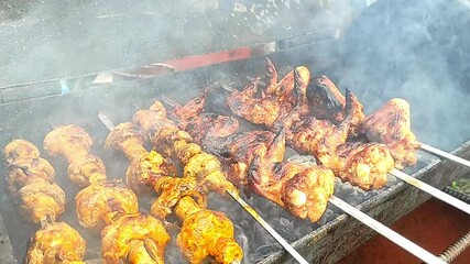 Shashlik grilled meat and champignons mushrooms cooked on mangal. High quality FullHD footage