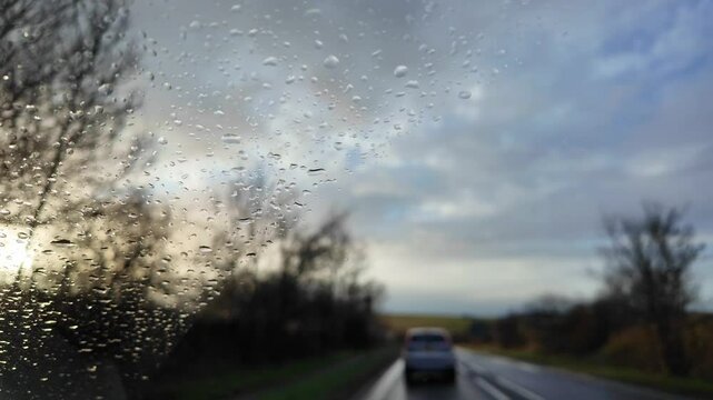 Wiltshire England UK. 10.02. 2024. Video. Traffic driving westward on the A 303 trunk road  on a very wet day in winter.