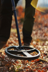 The ground metal detector is designed to search for treasures, coins and jewelry, scrap metal, close-up, while working