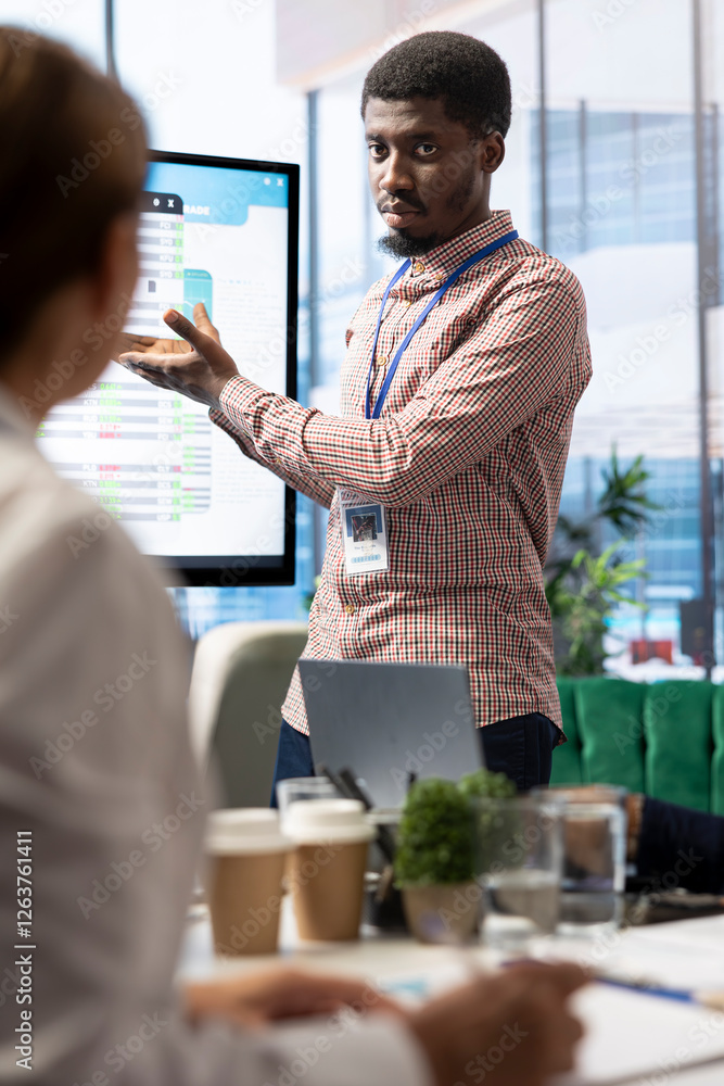 Poster company workers in a high end office space collaborating on project management tasks, utilizing digi