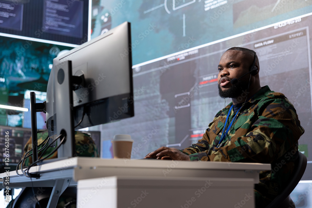 Poster high tech military soldier analyzing real time data for missions, processing intelligence and coordi
