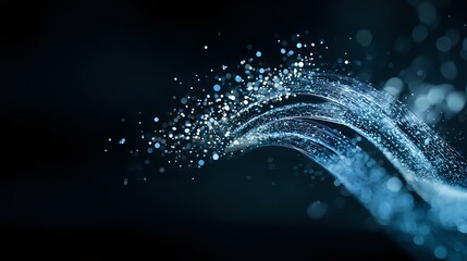 Glowing blue particles flow in curved lines against dark background creating dynamic motion effect with bokeh lights and sparkle elements.