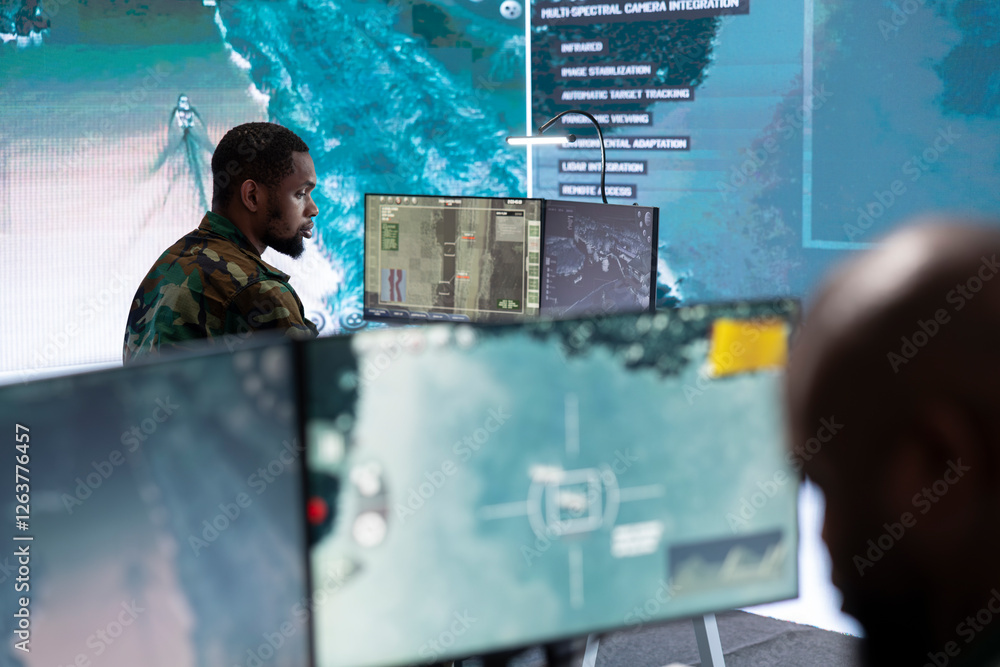 Poster government intelligence expert in command post handles surveillance tasks, analyzing real time data 