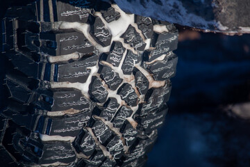 A 4x4 tire with snow in the treads